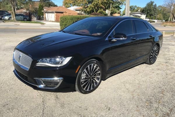 JM Transportation Service - Black Lincoln Town Car side view elegant luxury sedan for private rides and corporate transportation Los Angeles