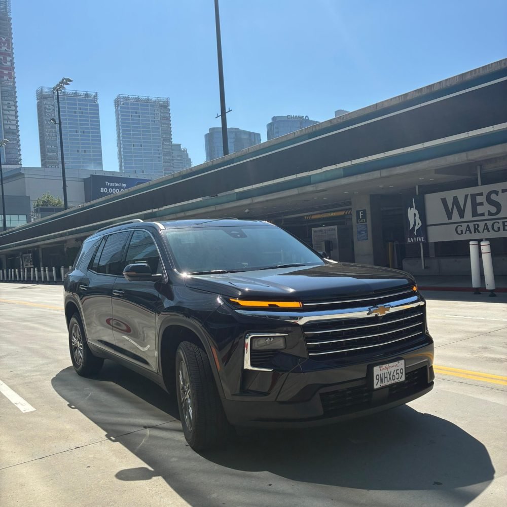 JM Transportation Service - Black 2026 Chevrolet Traverse parked in urban downtown setting for premium group transportation Los Angeles