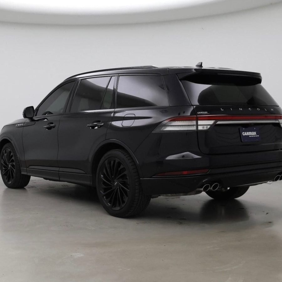 JM Transportation Service - Black luxury SUV rear three-quarter view with blacked-out design for VIP transportation Los Angeles