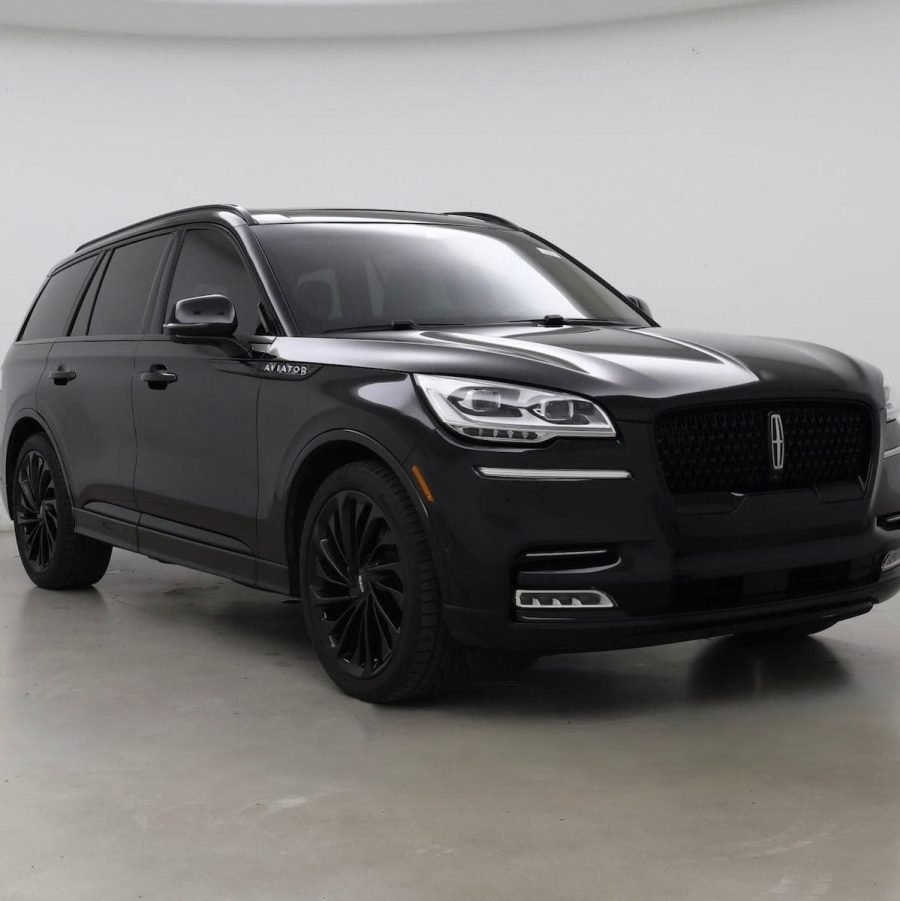 JM Transportation Service - Black luxury SUV front view in showroom for premium Los Angeles chauffeur and executive transportation
