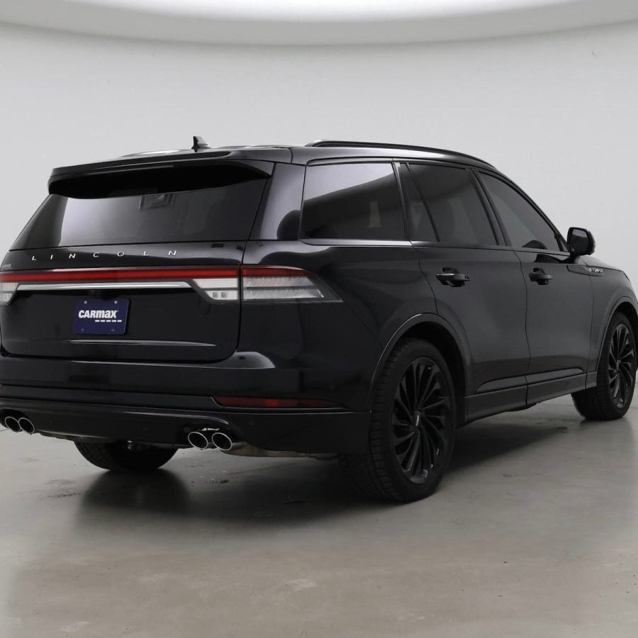 JM Transportation Service - Black luxury SUV rear view showcasing premium fleet vehicle for executive transportation in Los Angeles