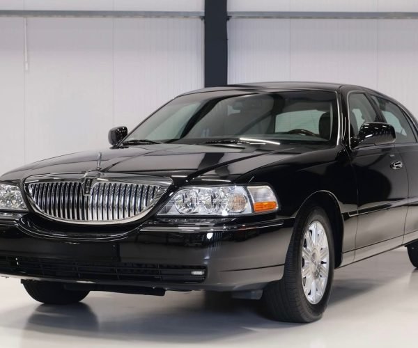 JM Transportation Service - Black Lincoln Town Car Side Front View Luxury Sedan Fleet