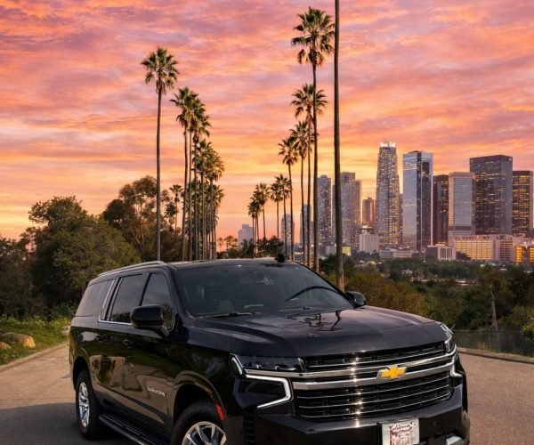 JM Transportation Black Suburban Los Angeles Skyline Sunset